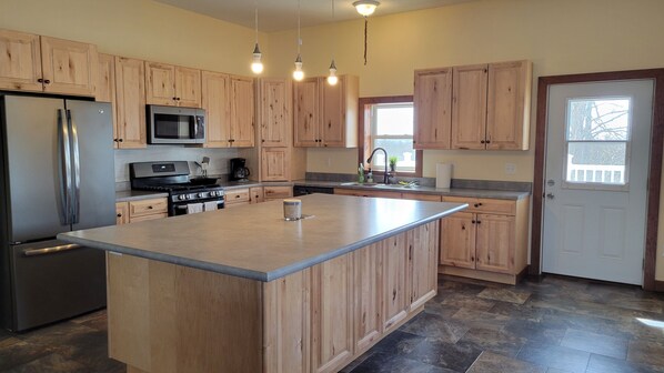 Open kitchen and dining space with country views.  