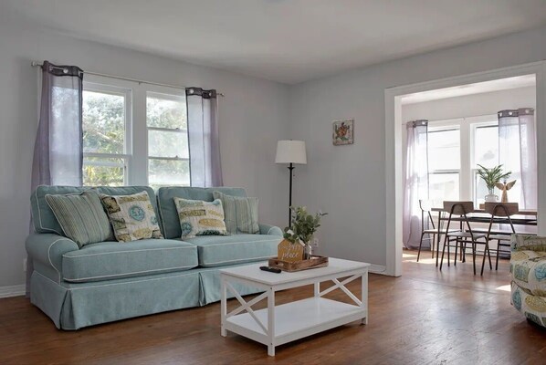 Cozy living room with sofa and a center table.