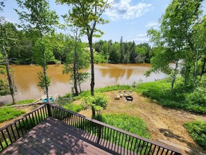 Upper deck view of the river and dock with Kayaks for guest use late May to October.