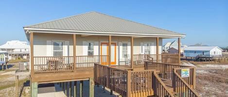 Back deck of home looks at the Gulf.  Covered and open areas. Gate that closes