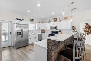 JUST renovated chefs' kitchen with beautiful quartz coutertops and breakfast bar