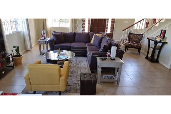 Relax in this big, bright, tastefully designed living room.  TV, Music, Read...