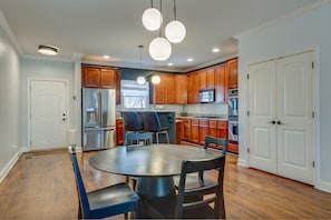 Dining room comfortably seats 4 people. There are also 2 barstools on the island