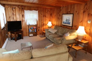 Living room with large flat screen TV.