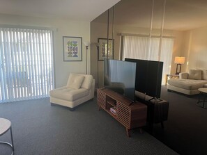 Living Room with Roko TV that is perfect for streaming your apps. Plus cable.