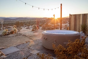 Watch the sunset while relaxing in the hot tub. 
