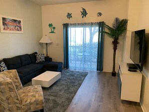 Living Room with 65" TV and Luxury Vinyl Flooring