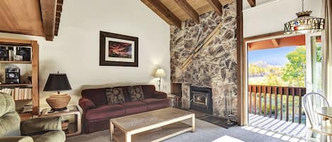 Living room with wood burning fireplace