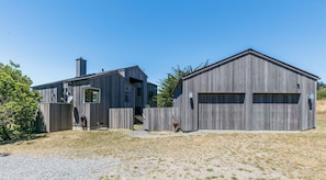 Gate to the left of the garage takes you to the front door.