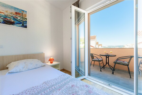 bedroom with a private balcony