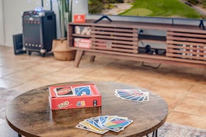 Unwind with friends and family over a game of Uno.