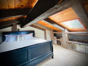 King Bed in Loft area with luxury mattress, skylight & windows w/mountain vistas