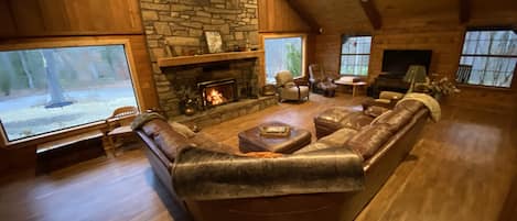 Gather your family around this massive fireplace and views of Piney Woods