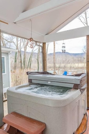 Let your worries float away while soaking in the hot tub and enjoying the river views