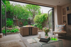 Doors lead from the living and dining area directly into the garden