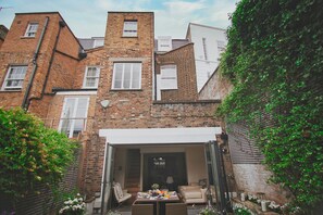 The back of the four storey Grade II Property