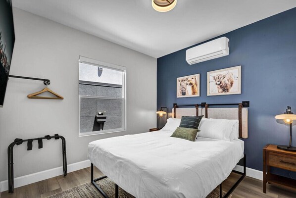 Curl up in comfort and style on the plush queen-size bed.