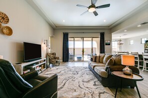 Living room has queen size sofa bed with a memory foam mattress.