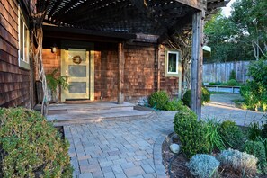 Outside the front door are gardens filled with flowers, fruit trees and herbs.