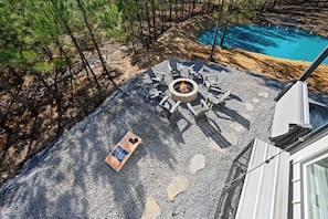 Relax by the firepit or play a game of cornhole