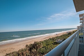 Take in breathtaking views from the 4th-floor private balcony, overlooking the serene beauty of New Smyrna Beach