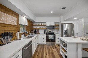 Fully updated kitchen with all stainless appliances (fridge, stove, dishwasher, microwave). Keurig coffee maker and coffee pods. Dishes. Classy quartz counters and fixtures.