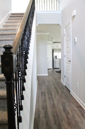 Upstairs staircase and downstairs hallway