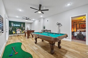 Spacious Basement Rec Room W/Pool Table, Foosball Table, Indoor Mini Putt-Putt, Oversized Connect 4, Board Games, & Wet Bar. Over 10 games to choose from!!