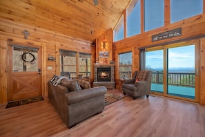 Great room/living room of this cabin with views and a cozy feel