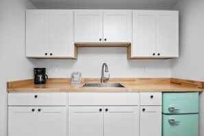 Enjoy a nice meal in the kitchenette area equipped with a mini-fridge, coffee maker, and microwave.