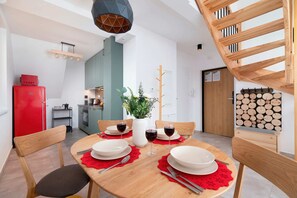 A charming dining setup with vibrant red and green accents, creating a festive atmosphere.
