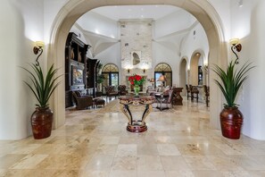 Grand entrance with high ceilings and luxury furnishings