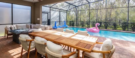Outdoor dining by the pool with ample seating