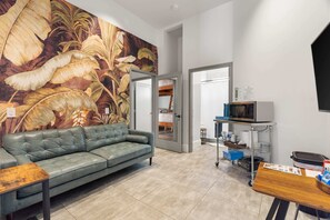Relax in style with vibrant decor and a comfy sofa — perfect for unwinding after a day of adventure