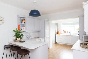 The light and airy kitchen has everything you need to prepare meals.
