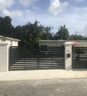 Gated and secured entrance with a 2 vehicle parking