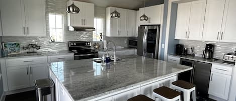 The kitchen has plenty of counter space and is open to rest of living area.