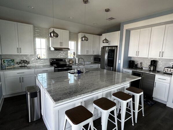 The kitchen has plenty of counter space and is open to rest of living area.