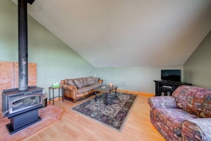 Comfy living room with woodstove and great views.