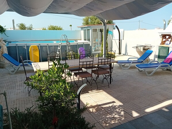 private terrace, upground pool, dining area