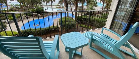 Tower 1 condo 110 balcony overlooks the main lagoon pool and splash pad.