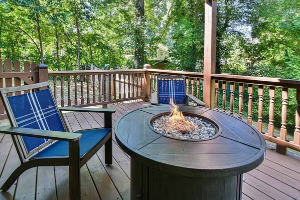 Bottom level back deck with hot tub and propane fire pit