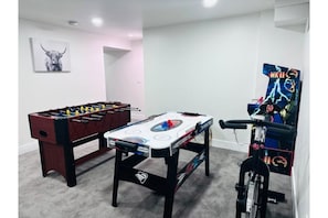 Game Room | Foosball & Air-Hockey Table | Arcade | Stationary Bike