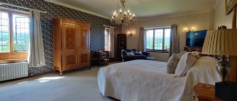 Heddon master bedroom and double aspect view with Angel Strawbridge wallpaper