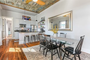 Dining room table and counter have ample seating