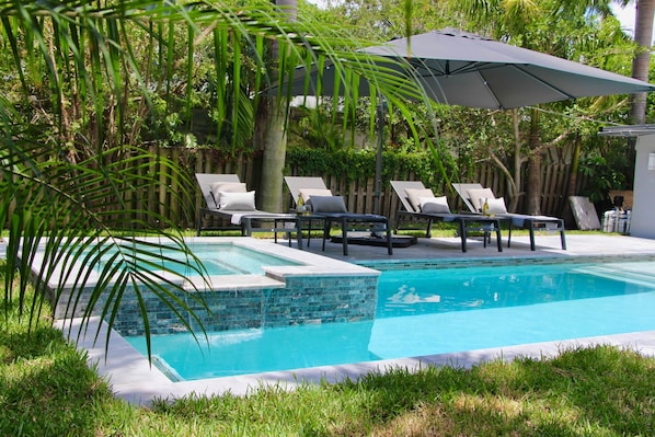 Indulge in your private pool and spa amidst a lush tropical garden, offering ample privacy