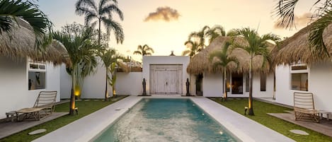 View of the villa’s entrance and outside pool 