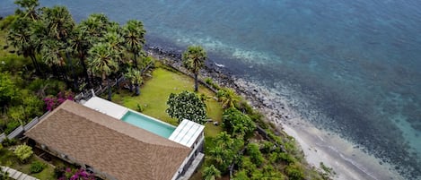 Drone view of the villa and natural surroundings 