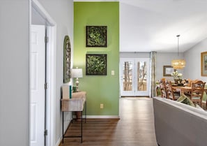 Spacious & stylish! Two comfy couches, a ceiling fan, and tons of natural light make this the perfect place to unwind. Flows seamlessly into the dining area and king bedroom.