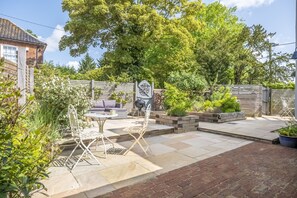 The Clockhouse, North Lopham: Enclosed patio area with outdoor furniture